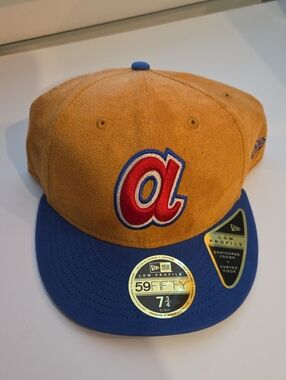 New Era gold suede cap with blue brim and red logo